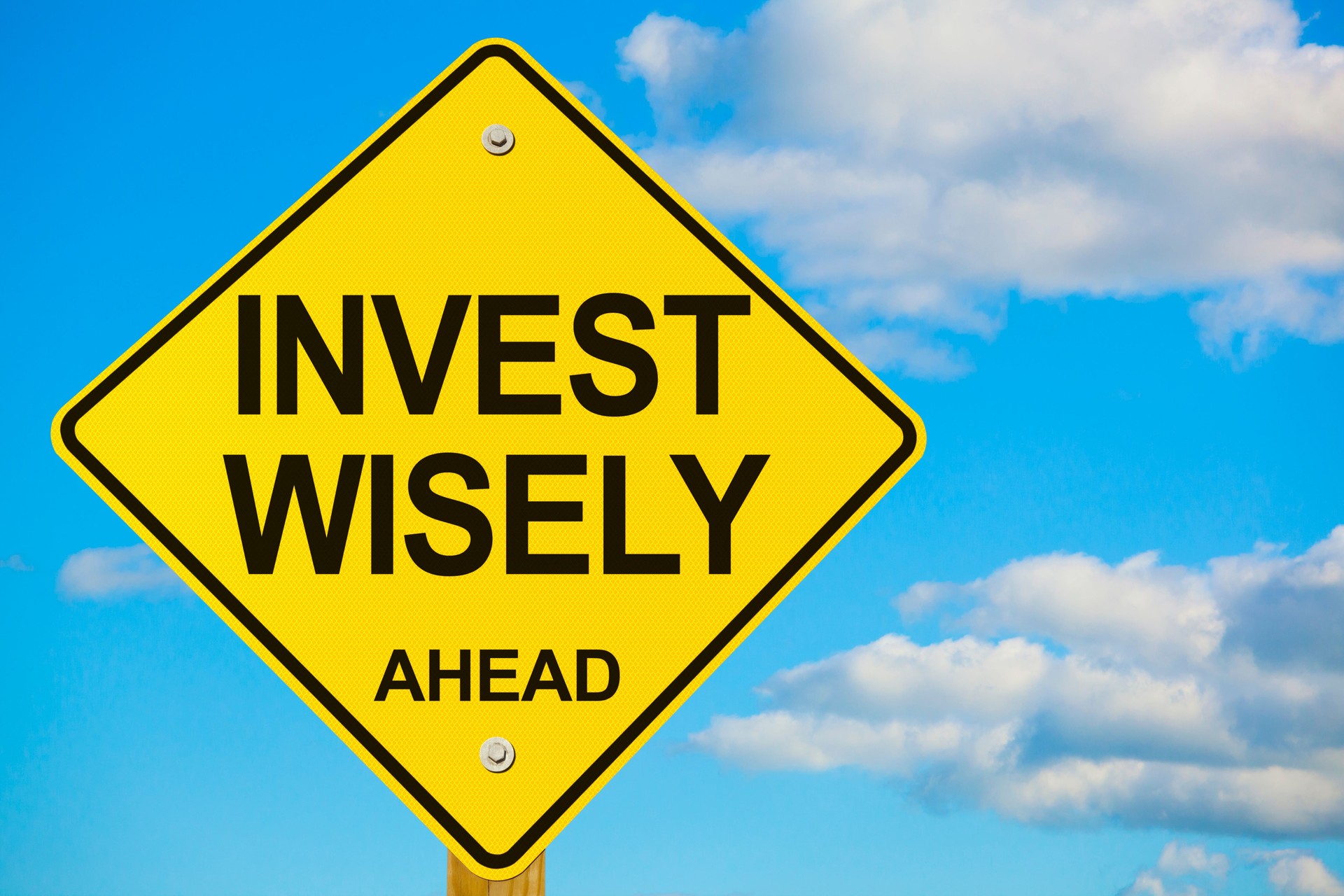 Invest Wisely Ahead Road Sign